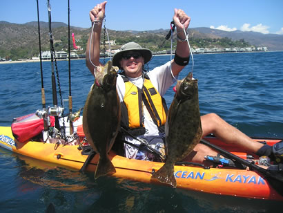 Kayak Sportfishing founder Jason Morton with 2 California Halibut