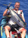 Jon Schwartz with another exotic - This hard fighting Ahi (yellowfin tuna) was caught off the coast of Kona, HI