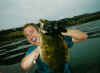 Happy kayak angler Dan Britton holding up a halibut for the shot