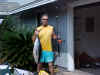 Bruce Gothard shown here with a 28 pound yellowfin tuna he caught mid-June 2003 about 4 miles out from Kailua-Kona, Hawaii. It was caught on 40# ande line with a 4/0 penn and 6 1/2' uglystik using a mirrolure deepdiving big game lure. Bruce paddles a Perception Prism kayak