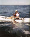 Jon Schwartz of Carlsbad, CA taking a breather after fighting one of the strongest fish in the ocean from a kayak, a Blue Marlin