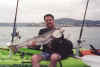 Dan Anello lands a nice white sea bass off the coast of La Jolla, CA