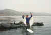 Jim 'Jimbo' Kracky showing off 2 nice halibuts he caught using live bait off the coast of Malibu, CA